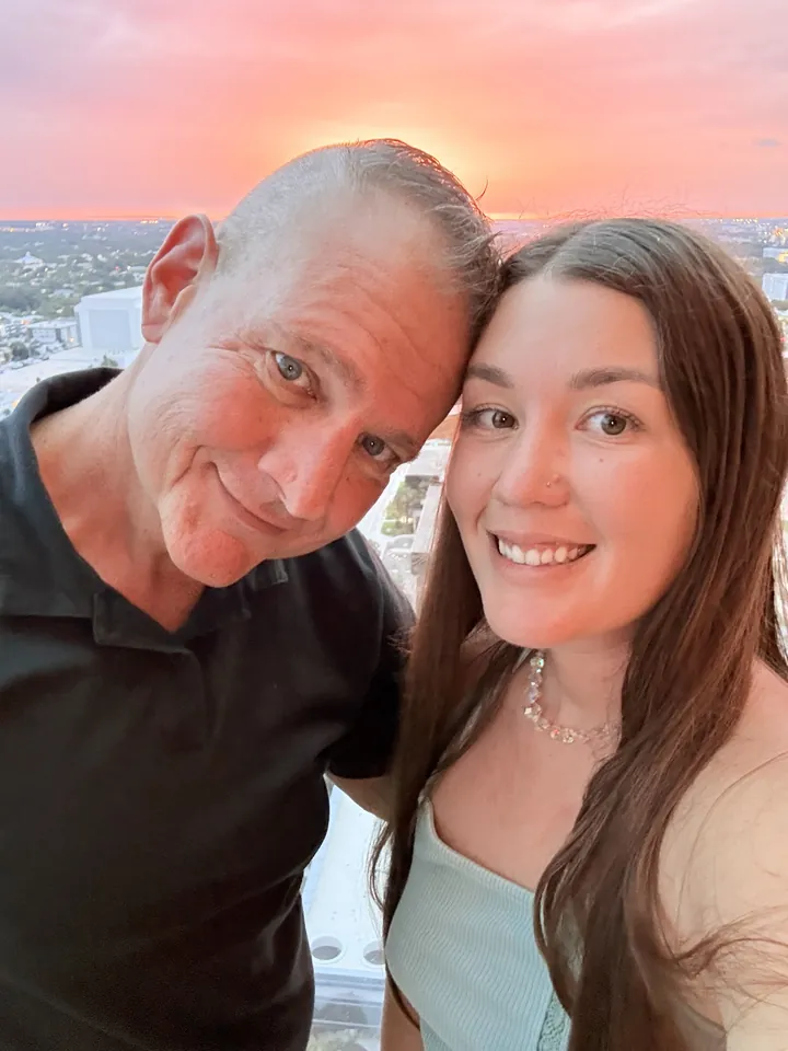 Drake Geramoni and Francesca Hasapes of FND Life smiling together at sunset